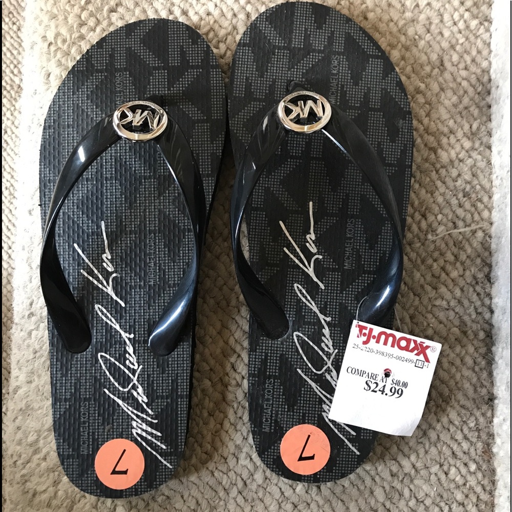 Brand new Michael Kors flip flops. Size 7.